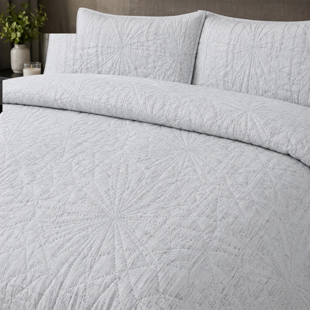 Pierre Cardin 3pc textured Pinsonic quilt in light gray with starburst geometric quilting, ideal for bed use