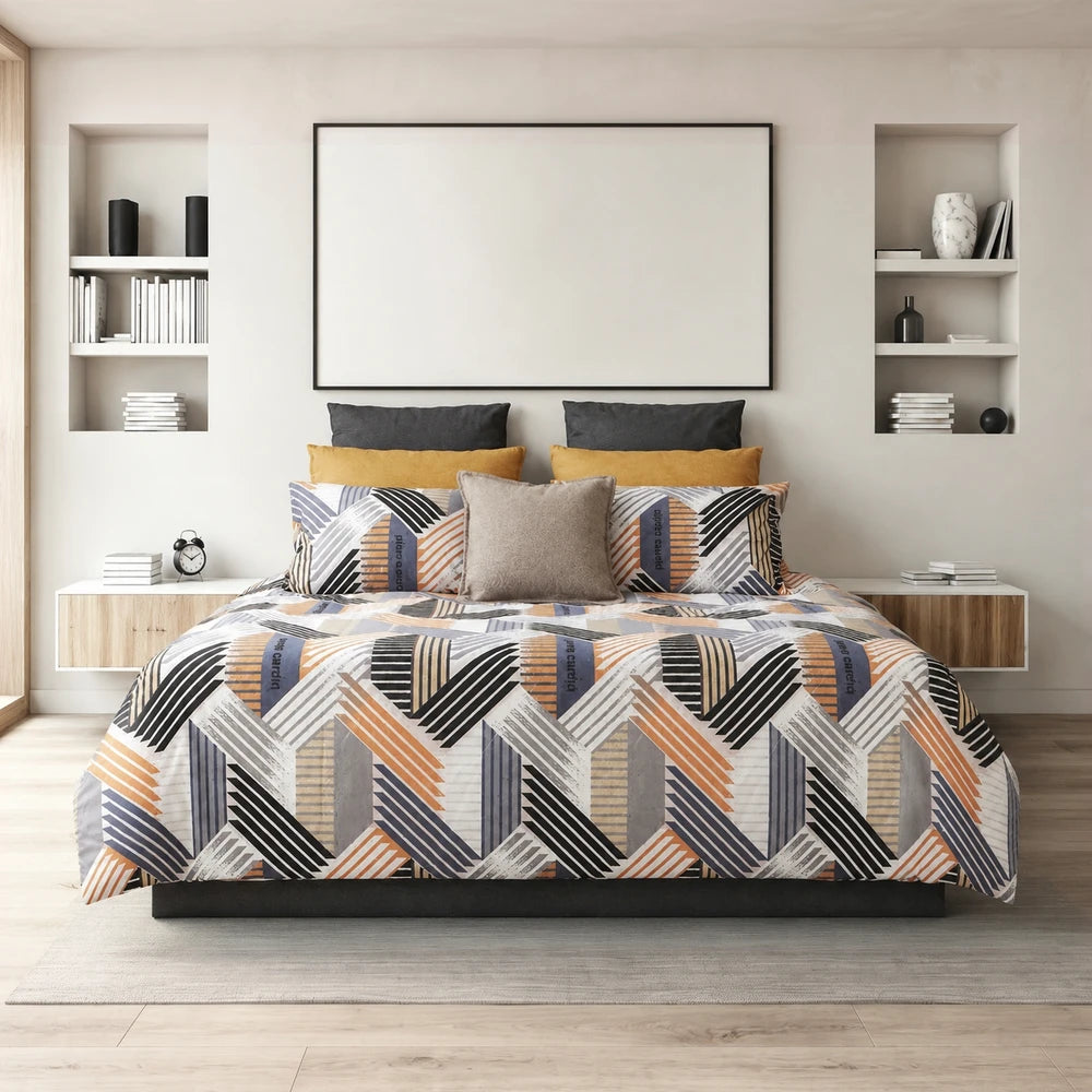Pierre Cardin Microfibre Duvet Cover Set Tiago with a geometric multicolor pattern in orange, blue and gray on a neatly made