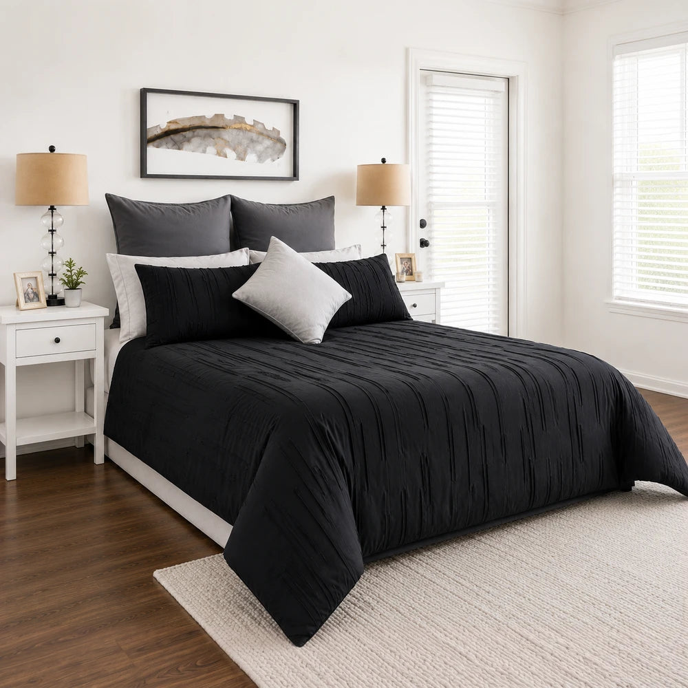 Pierre Cardin Trufted Stripe Duvet Cover in black with textured vertical stripes on a neatly made bed.