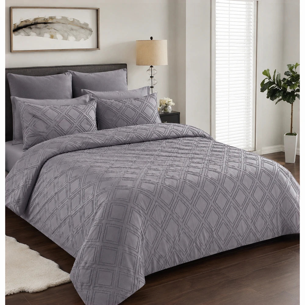Pierre Cardin Trufted Stripe Duvet Cover in lavender gray with a quilted diamond pattern, shown on a neatly made bed.