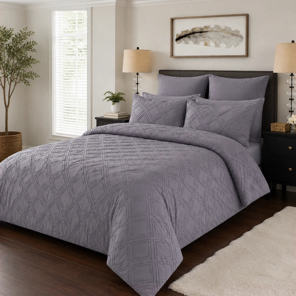 Pierre Cardin Tufted Stripe Duvet Cover in lavender-gray with a quilted diamond pattern for a soft, textured bed setup.