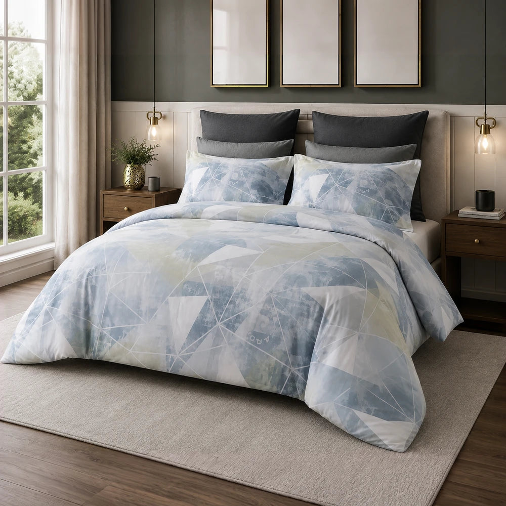 Pierre Cardin Vogue Duvet Cover Set - Anden Geo in light blue geometric pattern with soft fabric, shown on a neatly made bed.