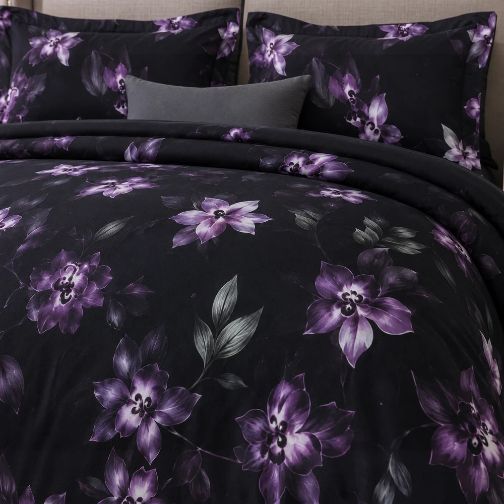 Pierre Cardin Vogue Duvet Cover Set in noir botanical purple florals on black, with matching pillow shams.