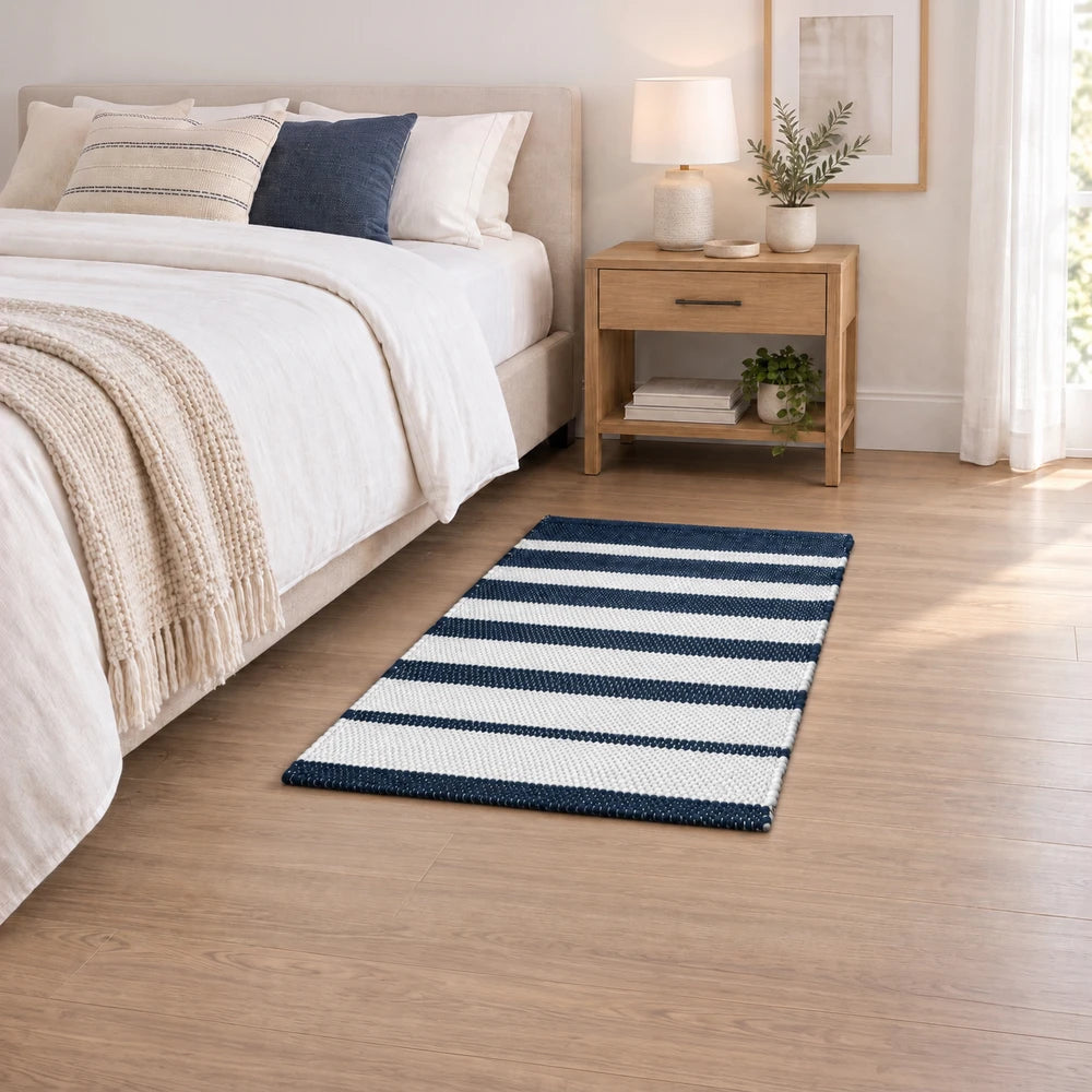 Premium Patta Chindi Rug in navy and white stripes, ideal for beside a bed or in a living space.