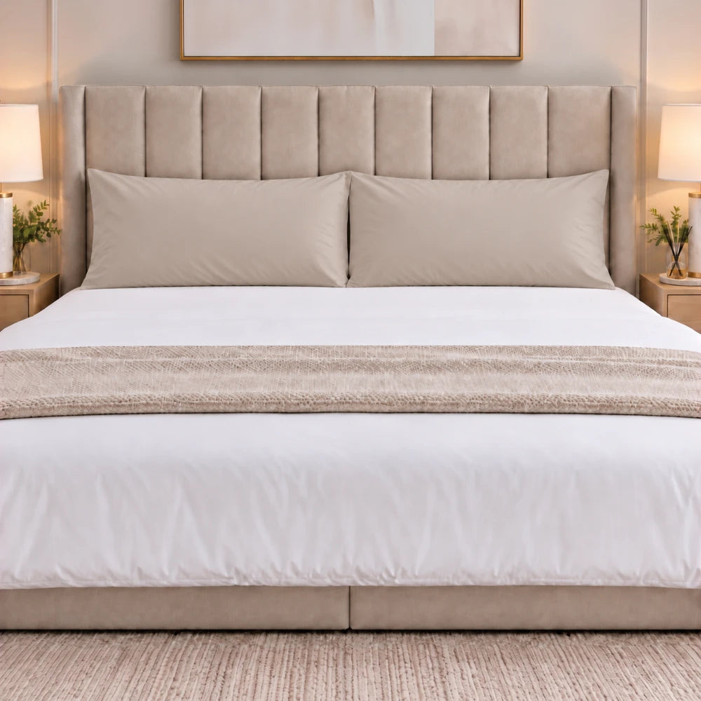Premium Soft-Touch Microfiber King Pillowcase Pack in beige with a smooth solid color, shown on a neatly made king bed.