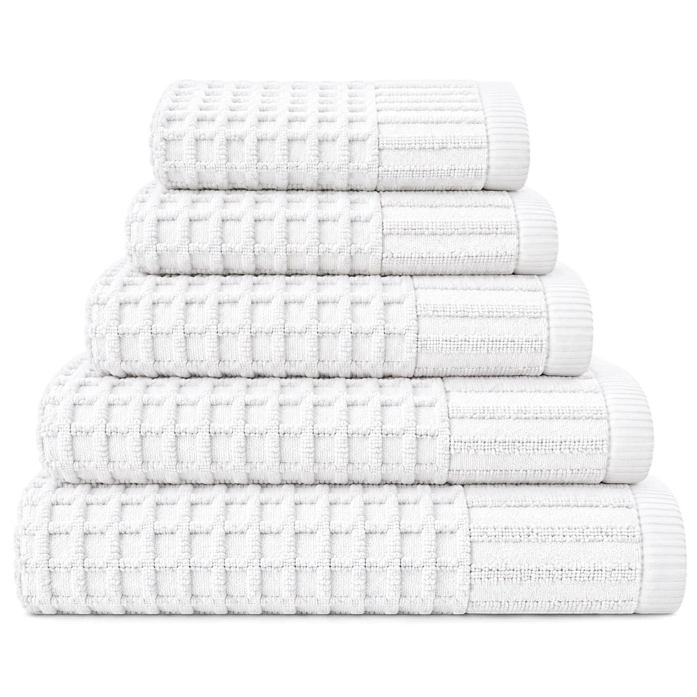 Stack of five premium white 100% cotton waffle weave towels with ribbed edges, neatly folded and stacked.