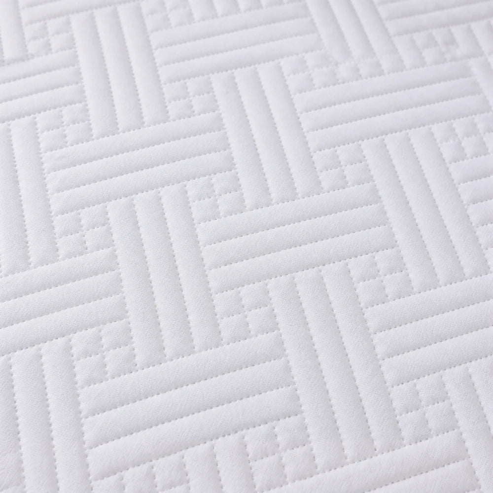 Quilted Mattress Protector in white with a geometric quilted pattern for added softness and protection.