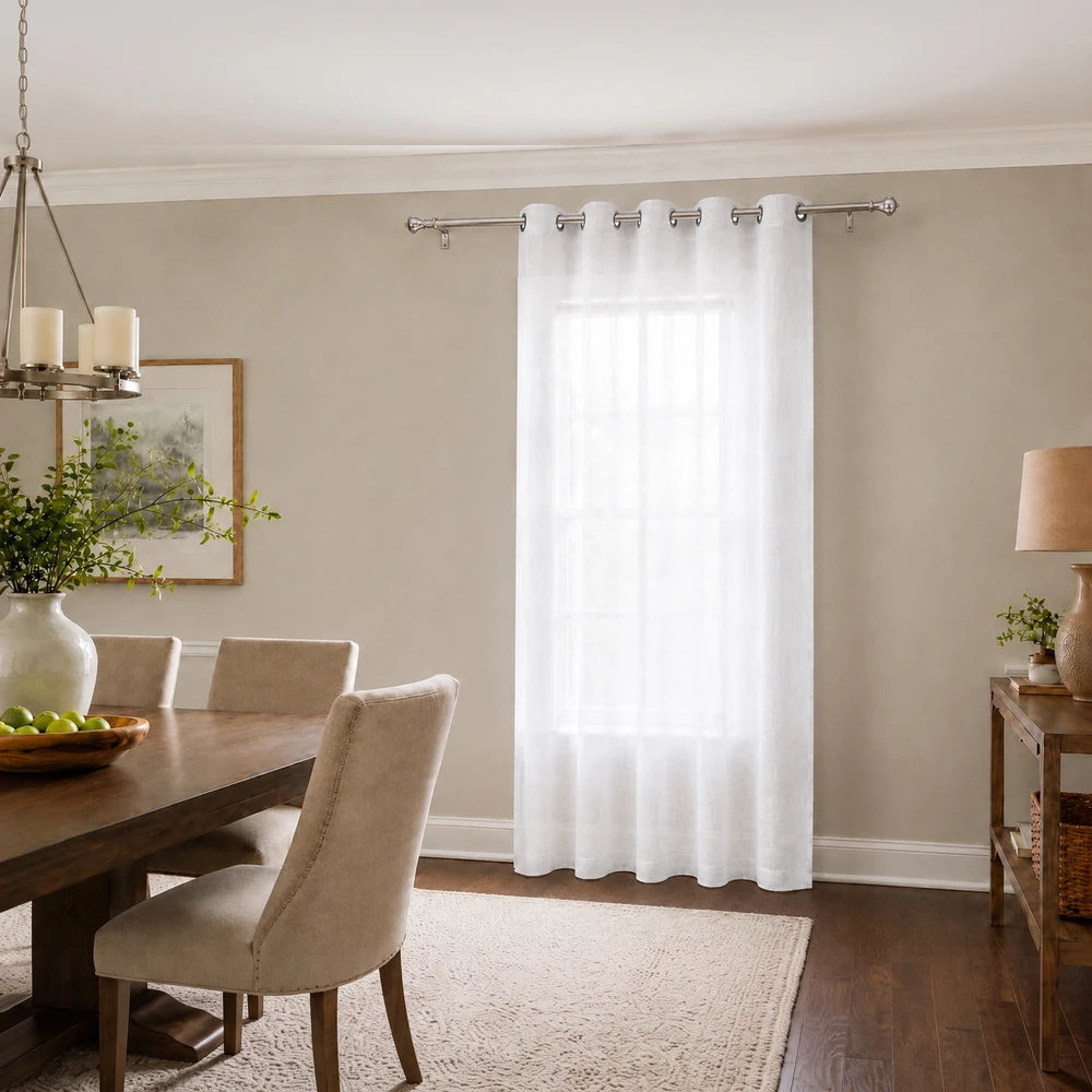 White sheer voile ready-to-hang eyelet curtain (140 x 225cm) shown in a bright dining room.