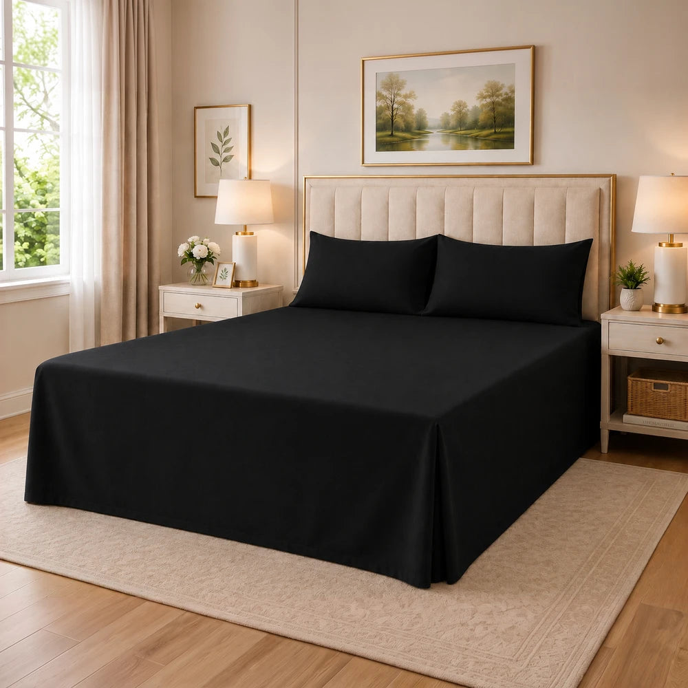 Tela Milano Easy Fit Combo black bed sheet set on a neatly made bed with a beige upholstered headboard and matching