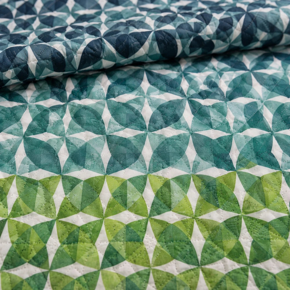 5PC Tela Milano Printed Quilt Set featuring teal–green geometric circle pattern and quilted stitching for a bold bedroom