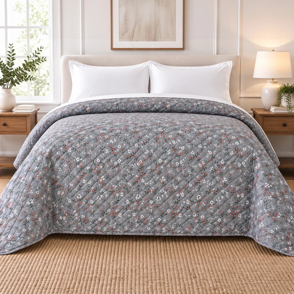 Ultrasonic 1-Piece Printed Quilt in heather grey with small white and red floral pattern, 220 x 200 cm on bed