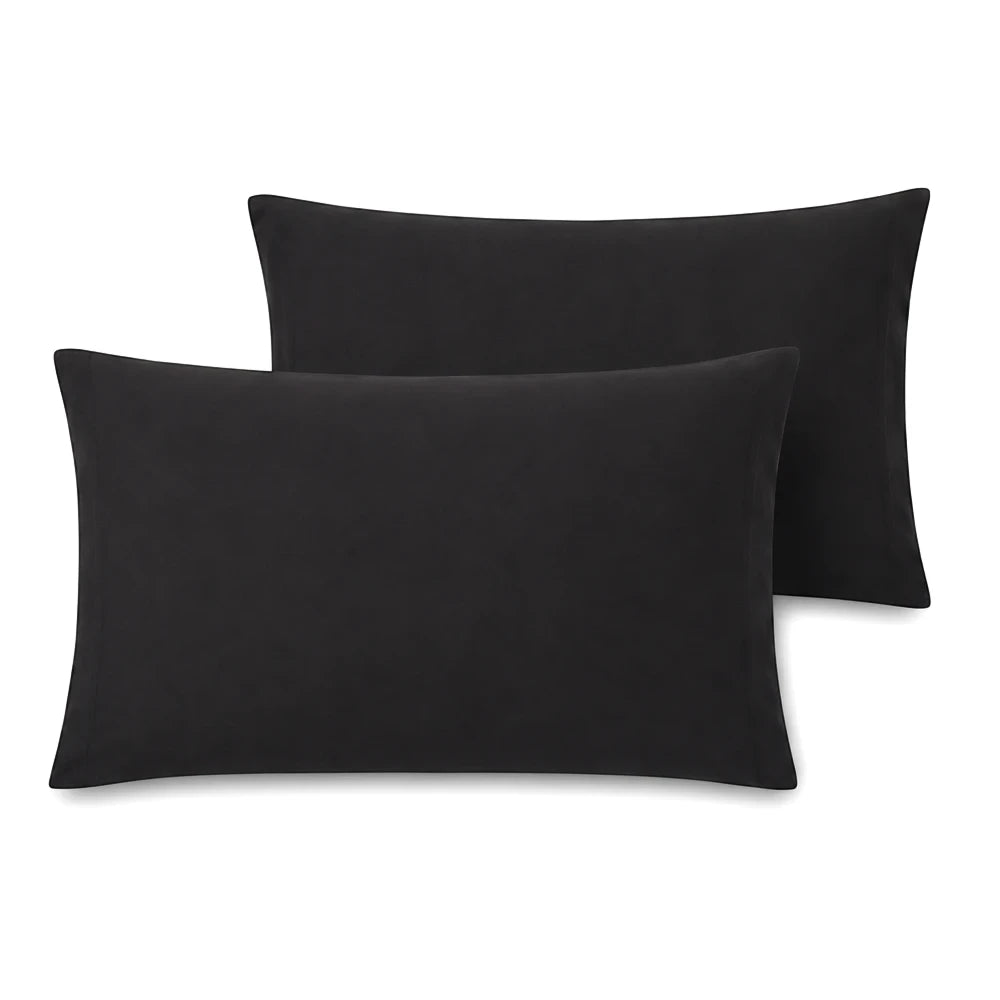 Two Whisper Soft Microfibre standard size pillowcases in black, visible from an elevated front view, showcasing their