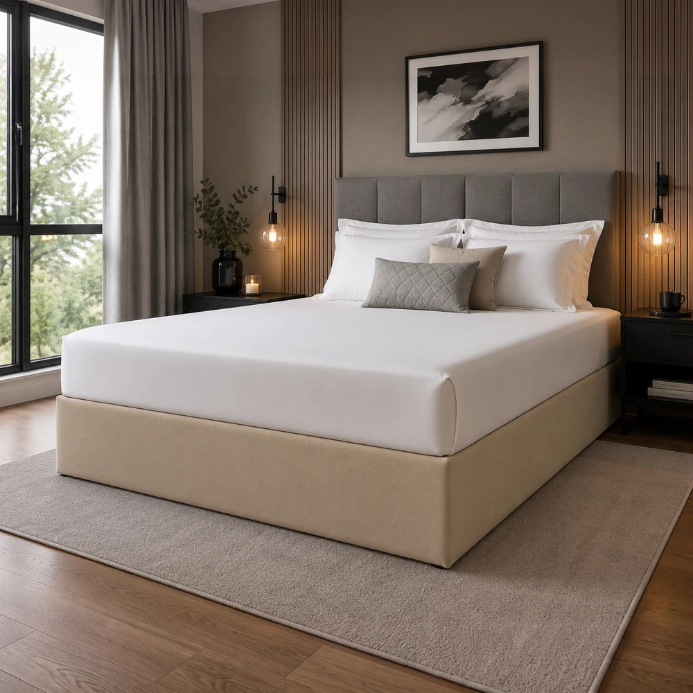 Whisper Soft Microfibre Bedwrap on a beige platform bed with white linens and a grey upholstered headboard in a bedroom.