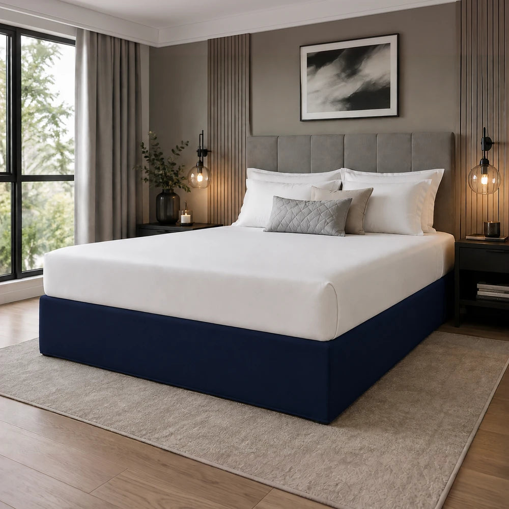 Whisper Soft Microfibre Bedwrap on a neatly made bed with white linens and a navy base, highlighting smooth fabric and clean