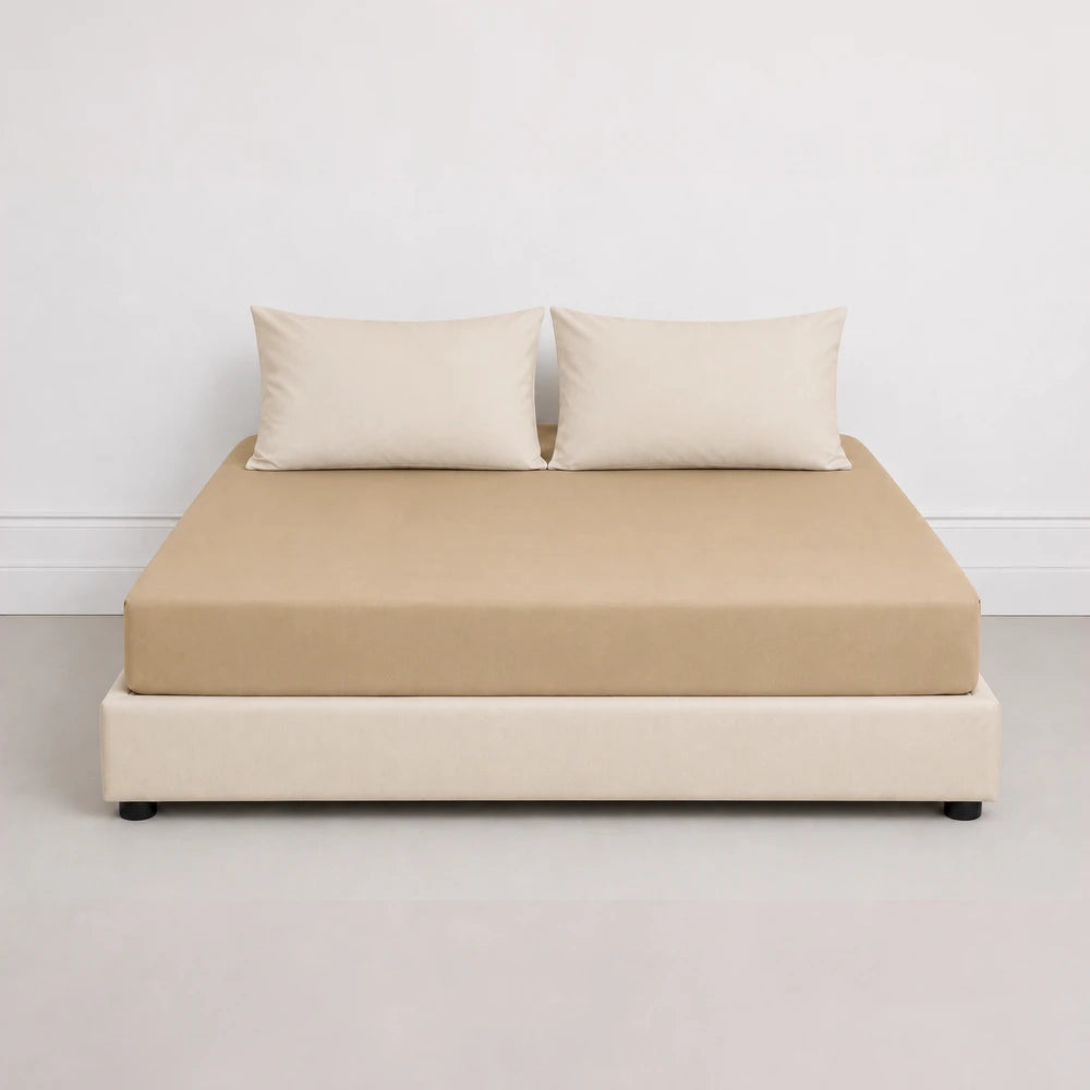 Whisper Soft Microfibre Fitted Sheet in beige on a neatly made bed with matching beige pillowcases.